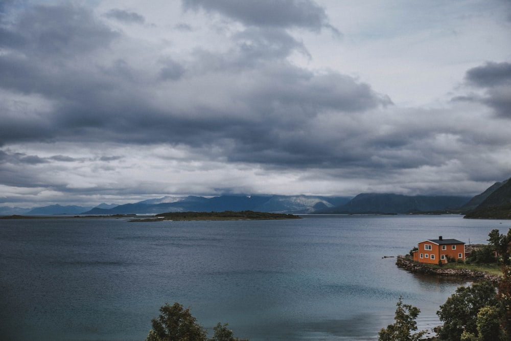 body of water under cloudy sky during daytime