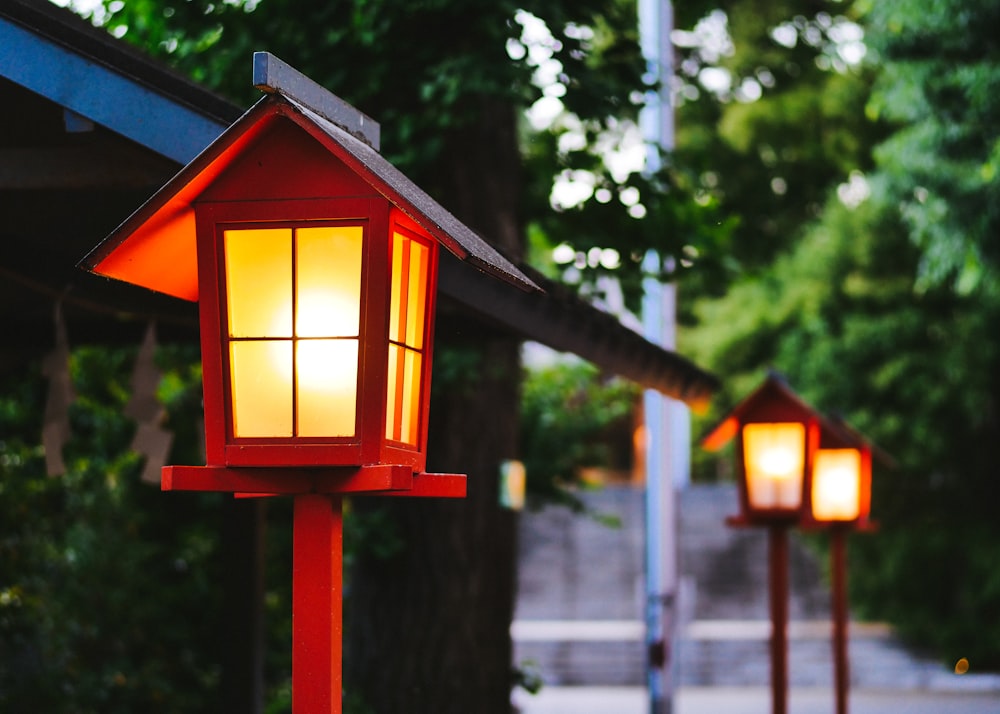 red and white wooden lamp post