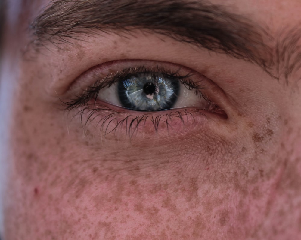 persons eye in close up photography