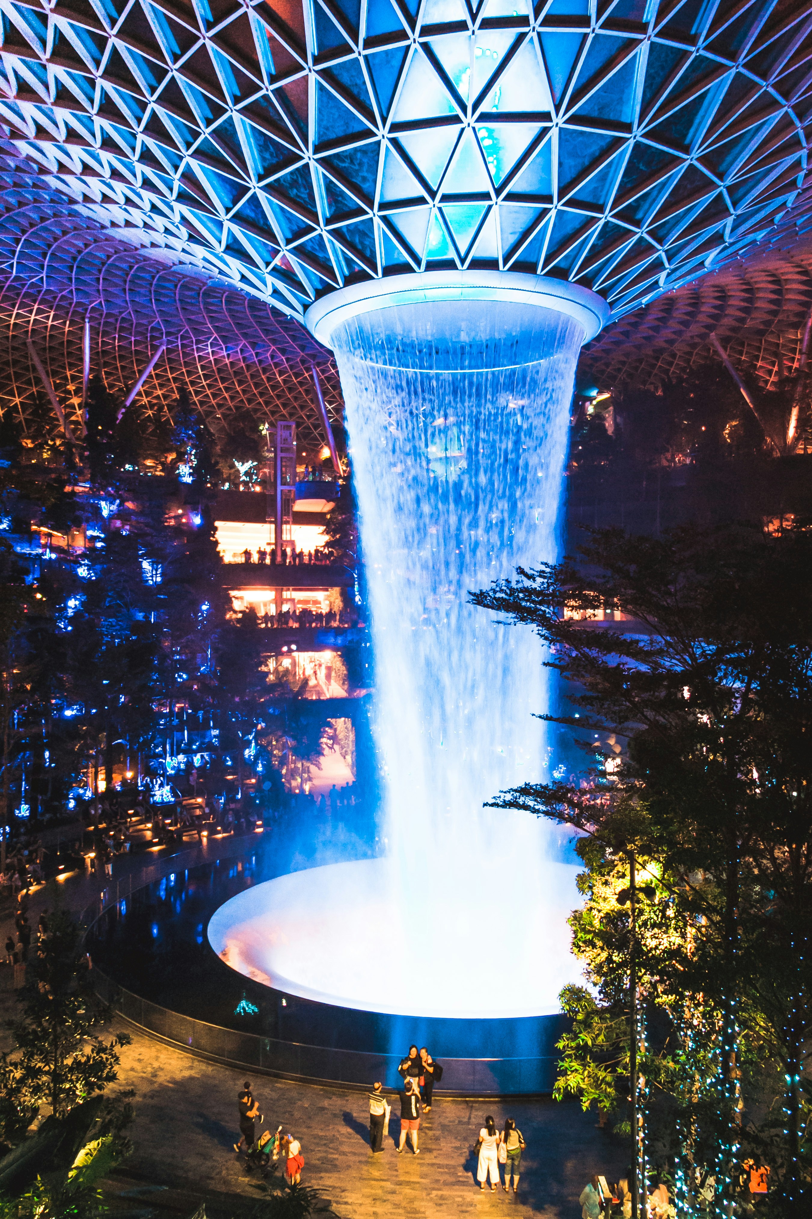 Water fountain in the middle of the city during night time photo – Free ...