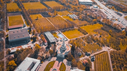 Aerial view of multiple square towers in a landscape.