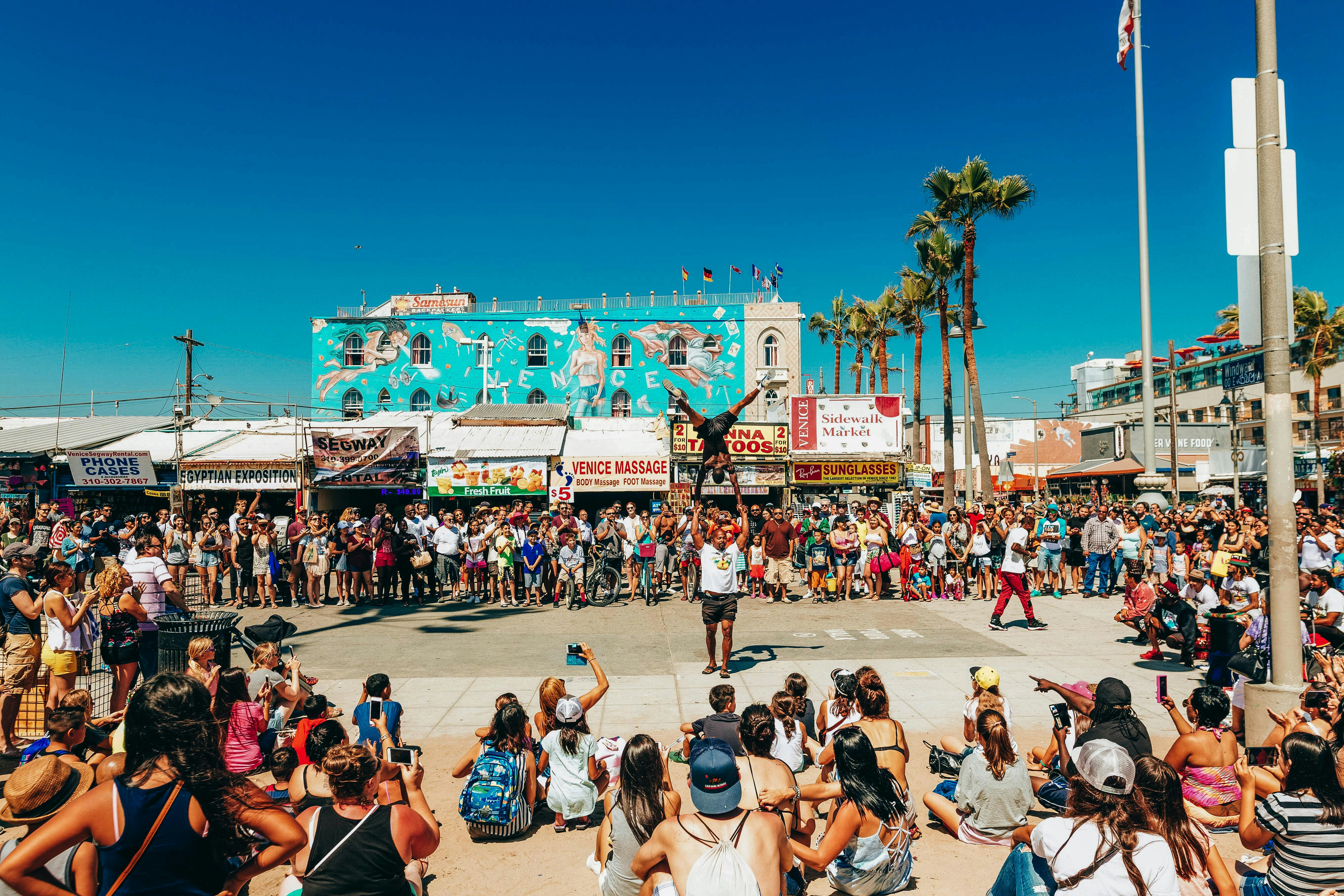 people sitting on white plastic chairs during daytime, more on leonardomale.com