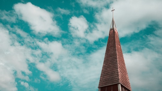 brown and gray church under blue sky in Canberra ACT Australia