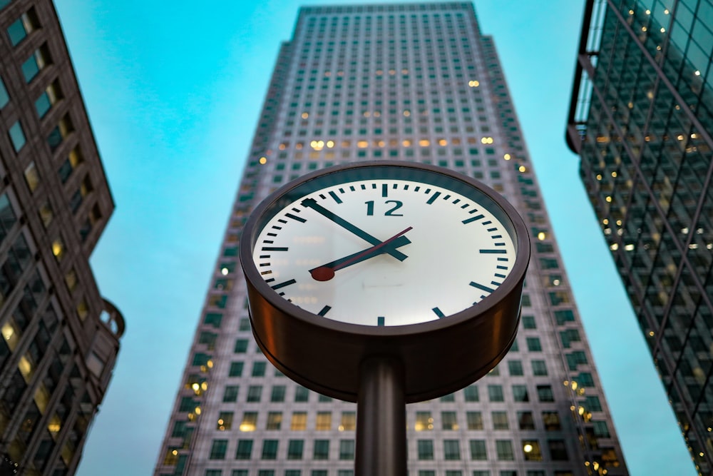 black and white analog clock at 10 00