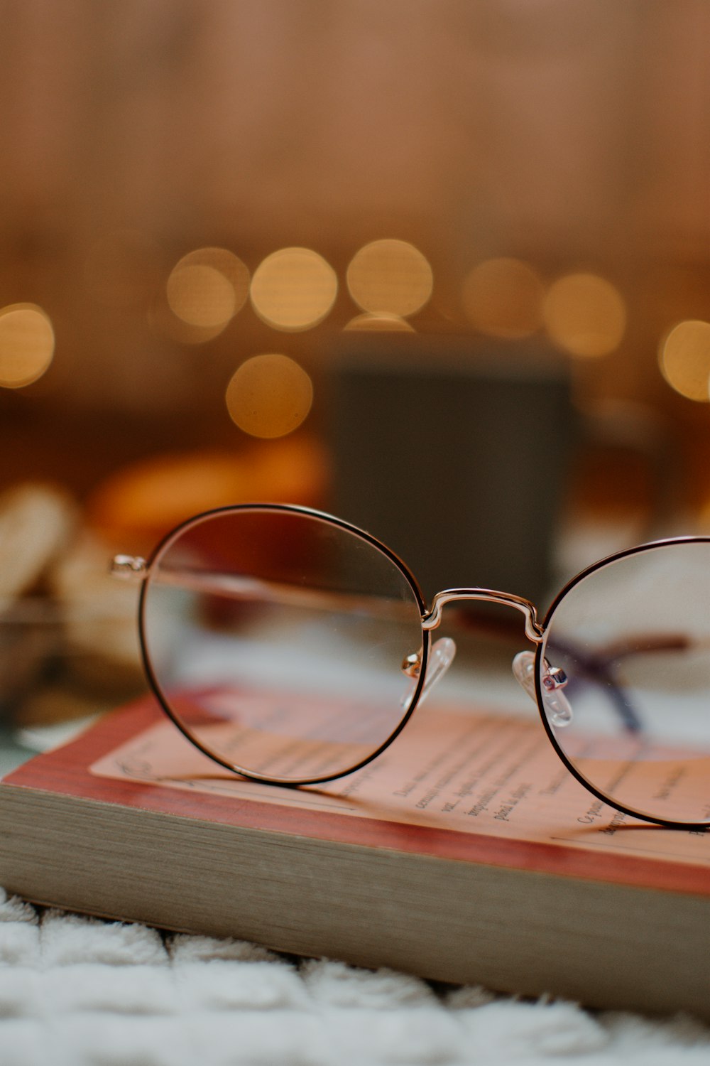 silver framed eyeglasses on book page