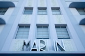 Exterior view of Marina Plaza building where MH Washing Machine Repair Services is located.