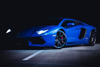 blue ferrari 458 italia on black background