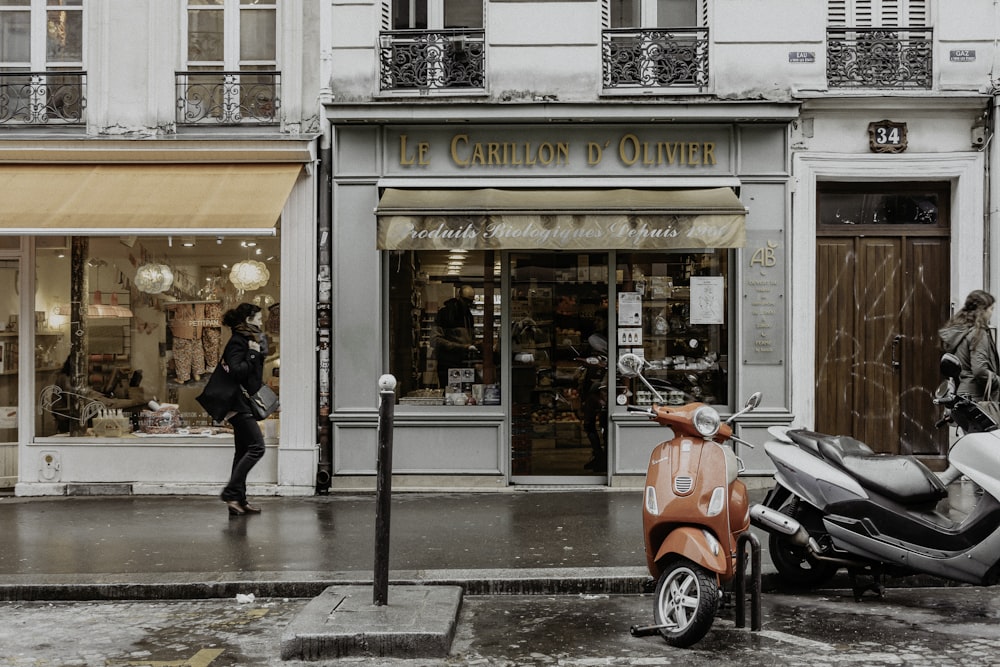 Red and black motor scooter parked beside the store photo – Free Paris  Image on Unsplash
