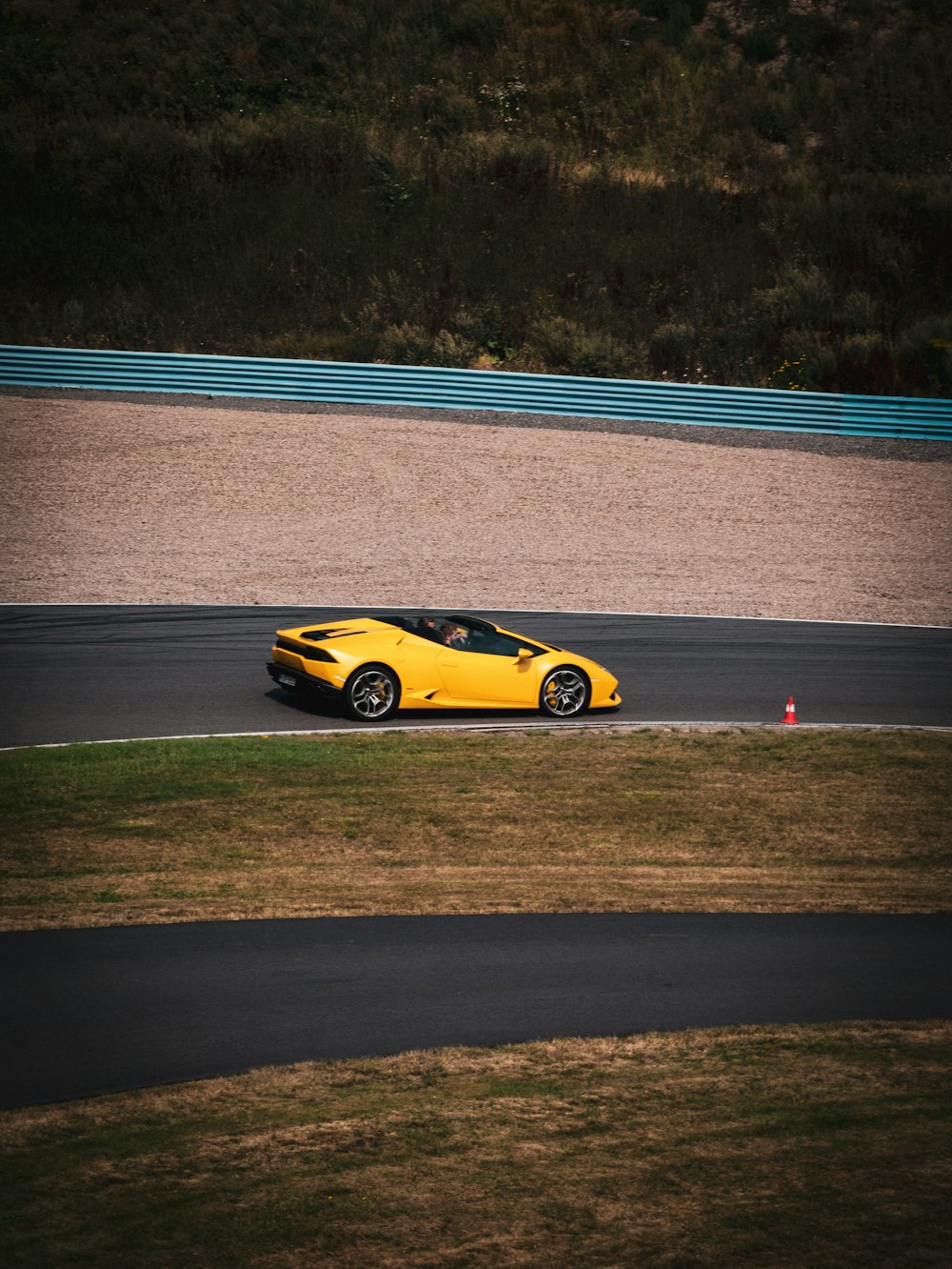 yellow ferrari 458 italia on road