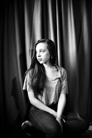 A candid portrait of a young woman styled in retro fashion, inspired by her grandmother’s influence.