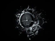 The titanium silver zeneio ring submerged in water droplets, emphasizing its waterproof durability.