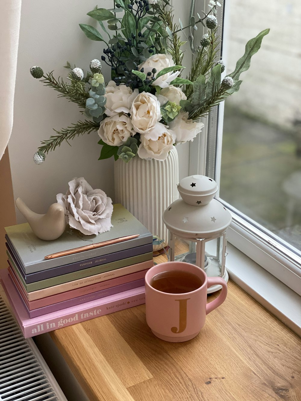 white ceramic teapot on brown wooden table