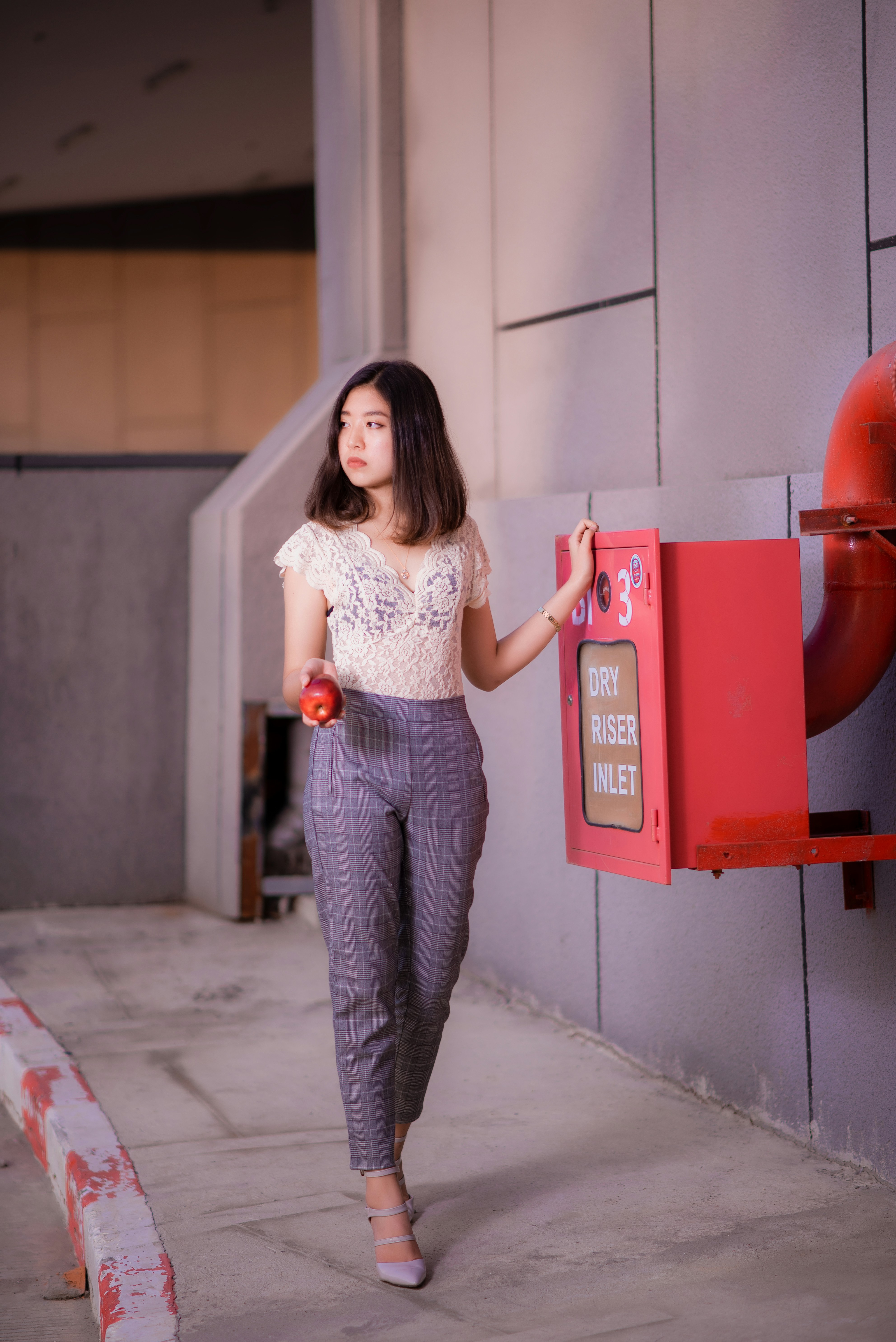 A stylish plus-size woman wearing city chic clothing