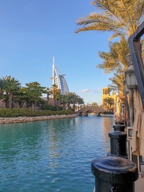Crystal-clear waters of Dubai Canal with a yacht anchored nearby.