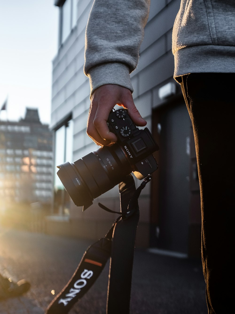 person holding black dslr camera