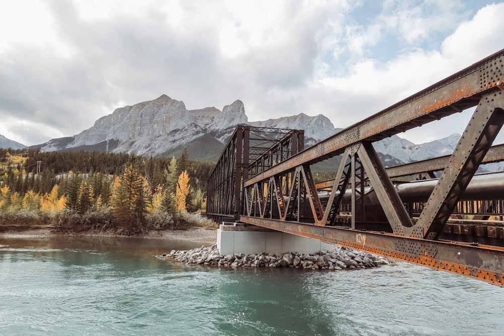 brown wooden bridge over river