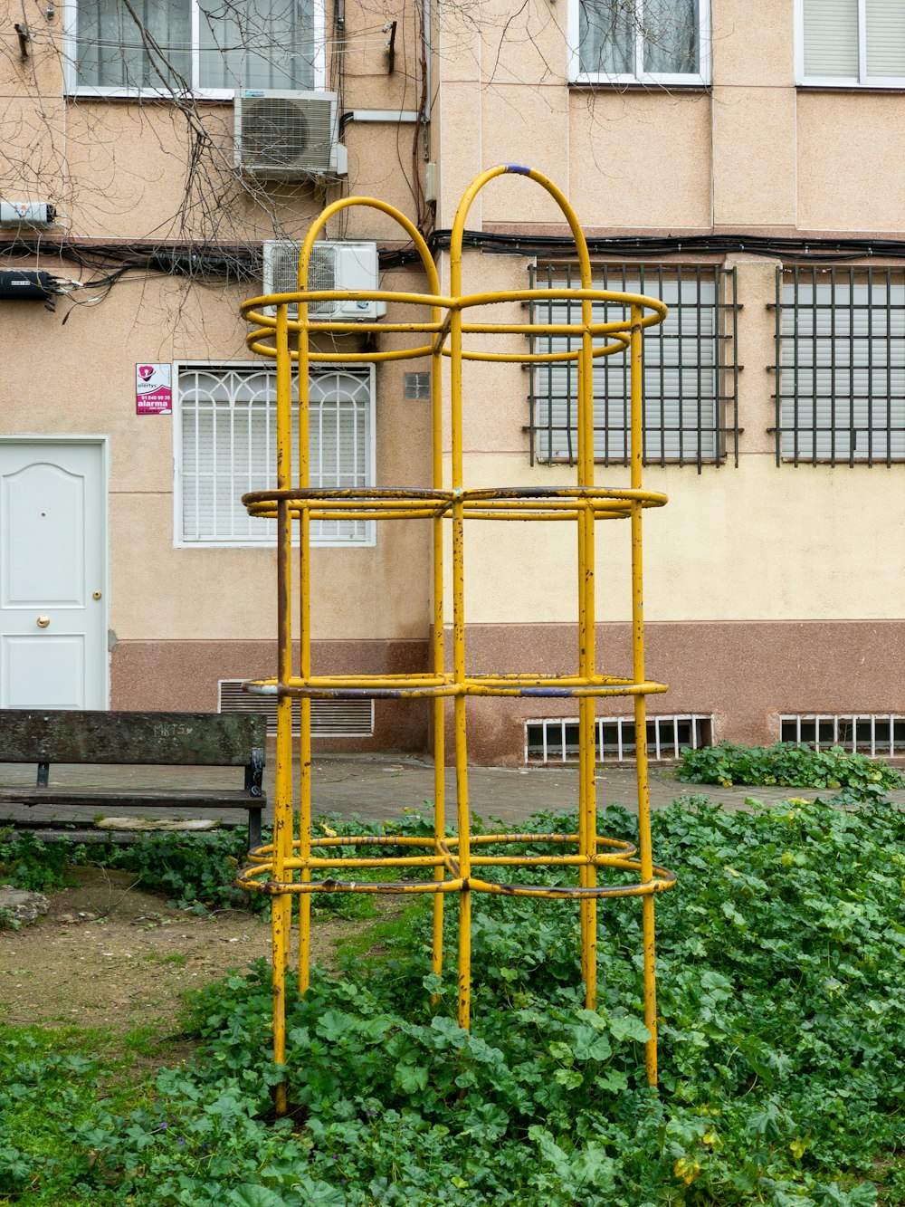 yellow metal ladder on green grass field