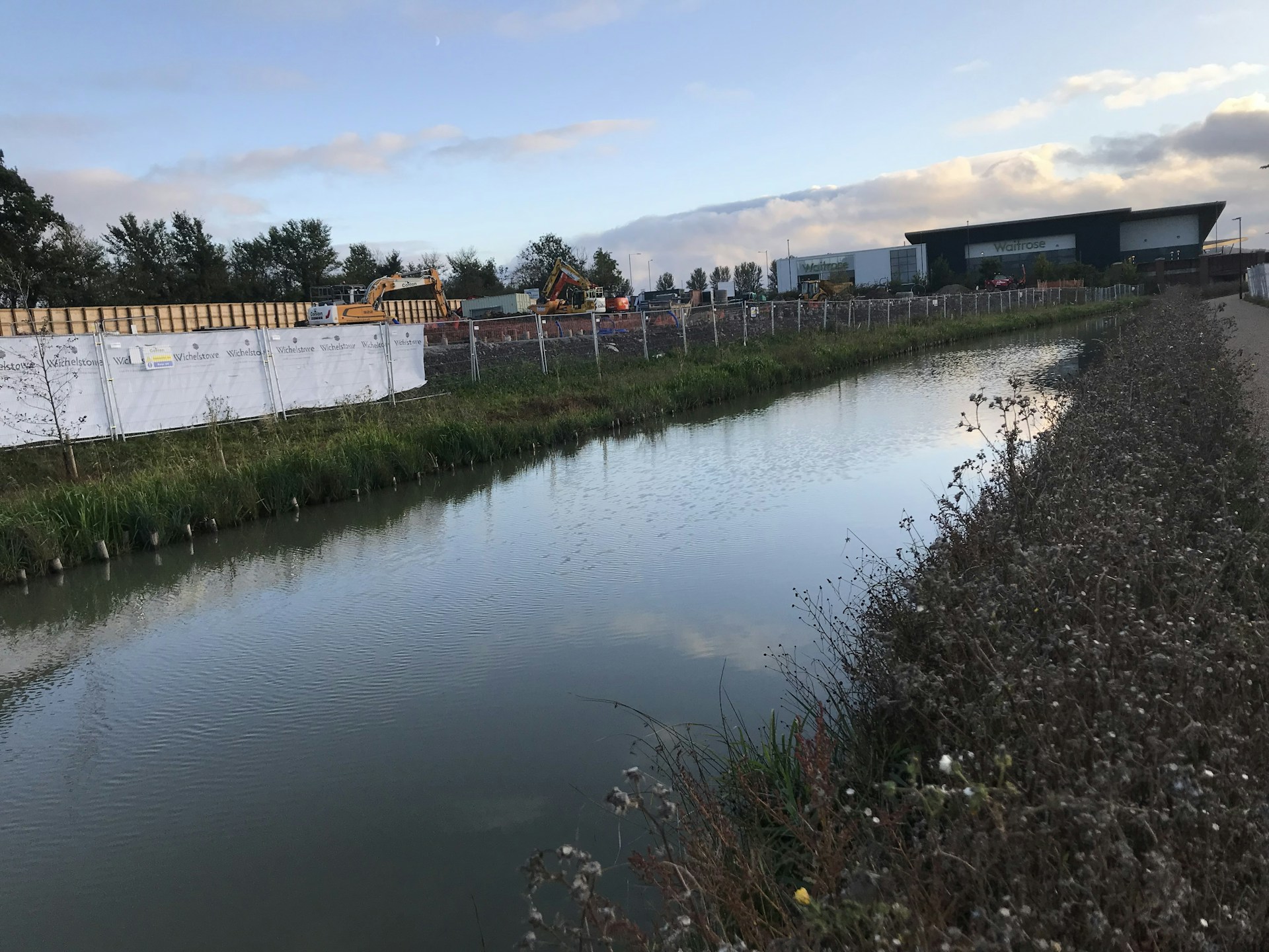 woman wearing yellow long-sleeved dress under white clouds and blue sky during daytime