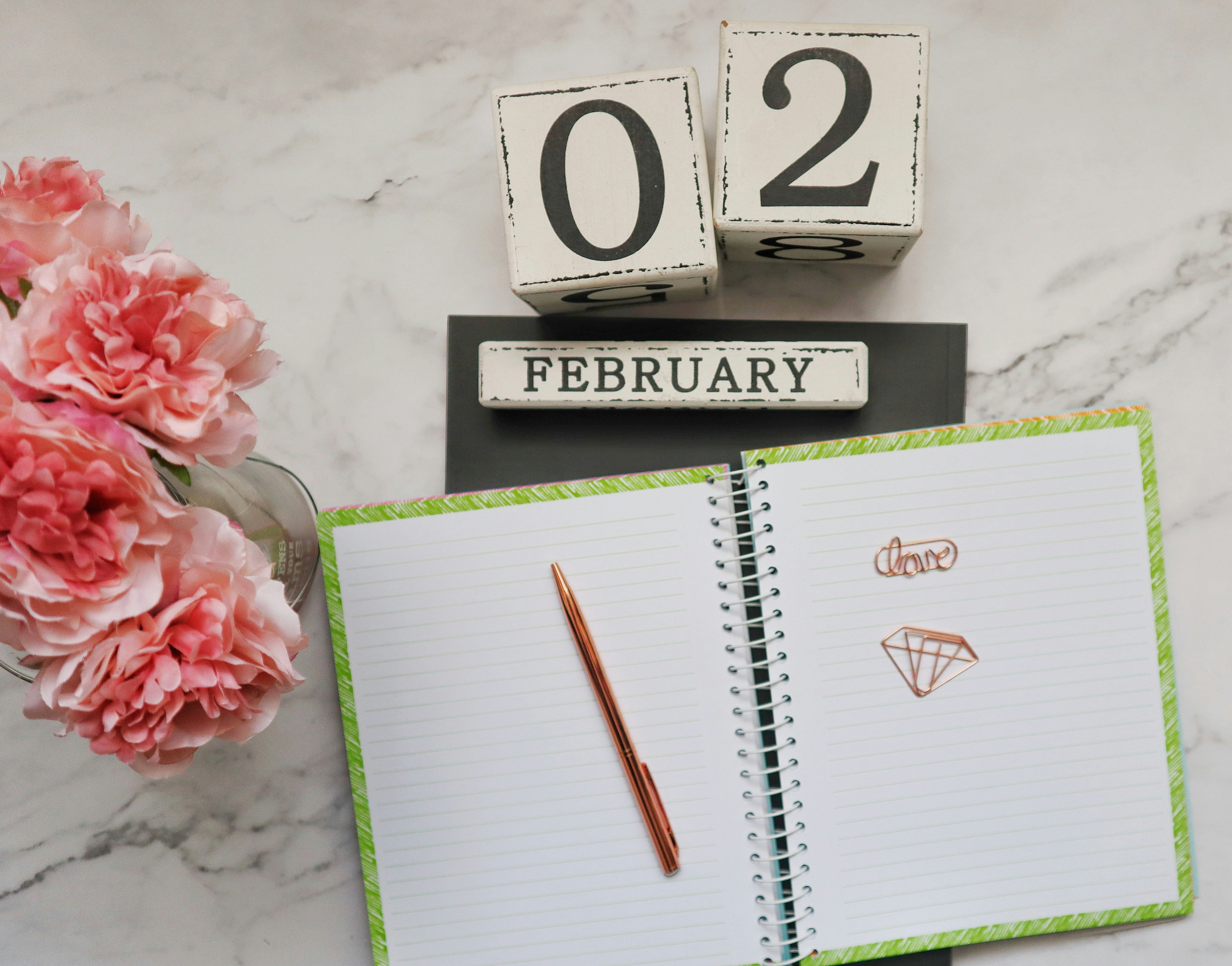 white and black calendar with red pen and white and black box