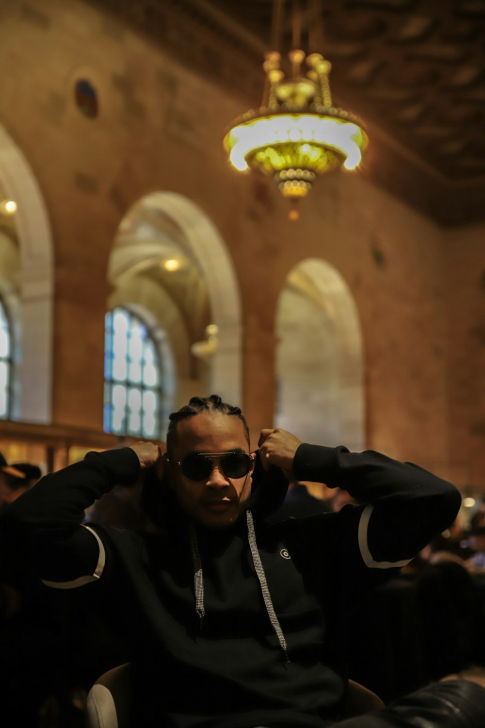 man in black jacket wearing black sunglasses