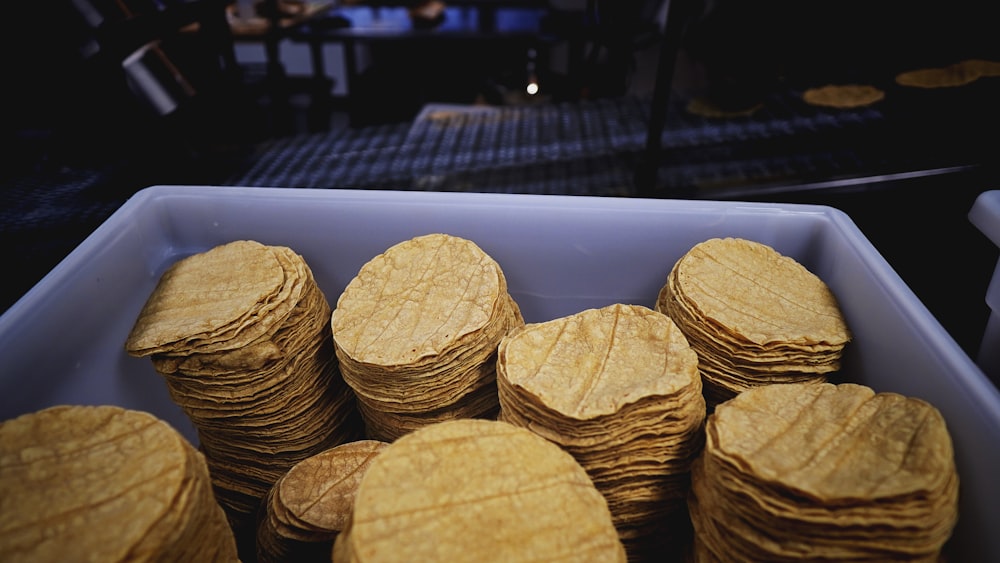 brown round biscuits on blue tray