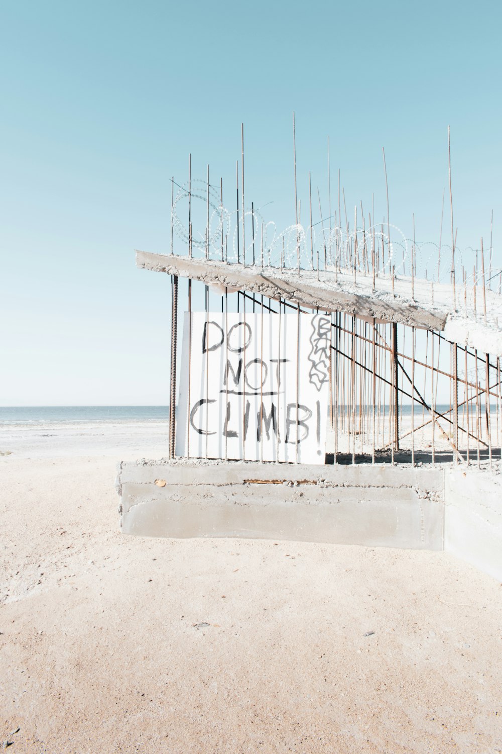 white wooden lifeguard house on beach shore during daytime