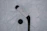Close-up of a hockey player gripping a sleek Kenny Hockey stick on the ice.