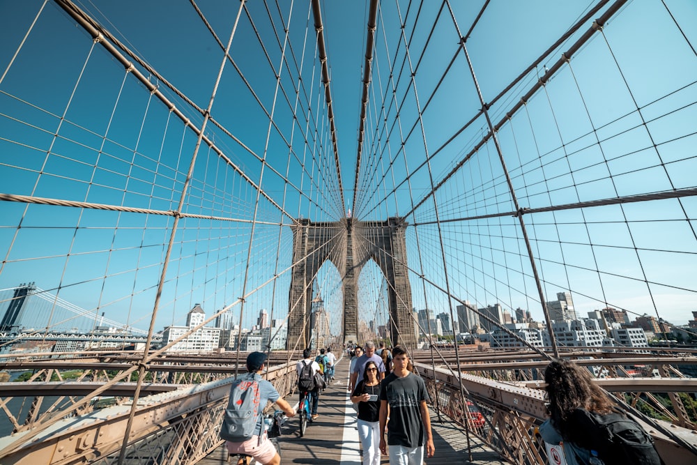 people walking on bridge during daytime