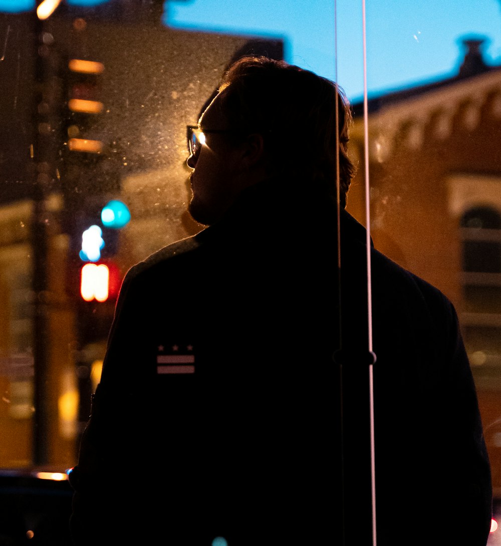 man in black jacket wearing sunglasses