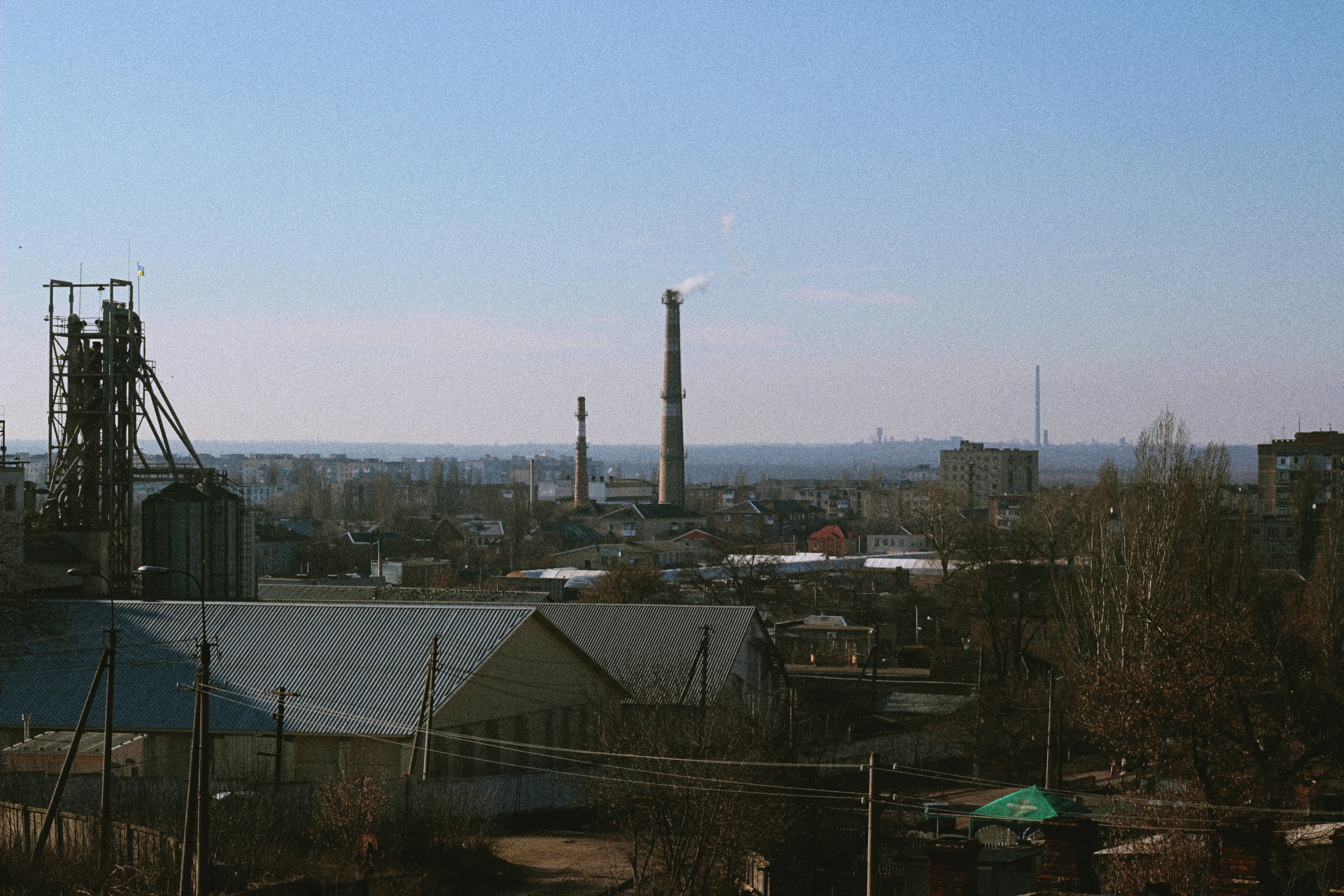 white tower near houses during daytime