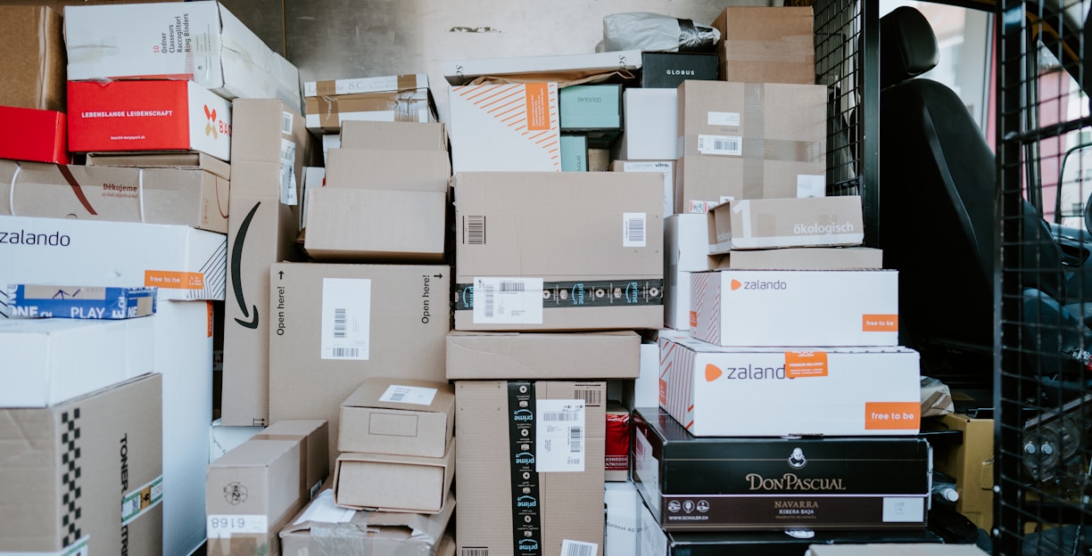 brown cardboard boxes on black plastic crate