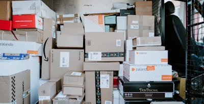 brown cardboard boxes on black plastic crate