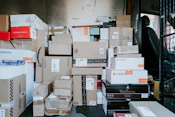 brown cardboard boxes on black plastic crate