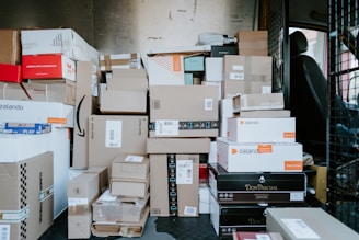 brown cardboard boxes on black plastic crate