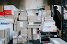 brown cardboard boxes on black plastic crate