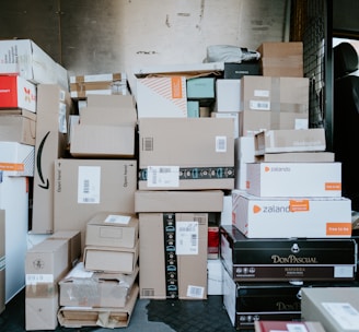 brown cardboard boxes on black plastic crate