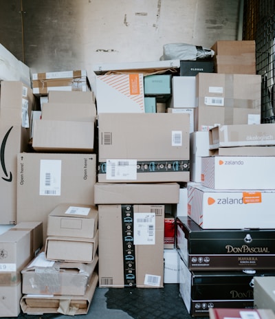 brown cardboard boxes on black plastic crate