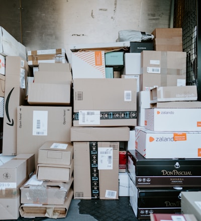 brown cardboard boxes on black plastic crate