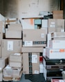 brown cardboard boxes on black plastic crate