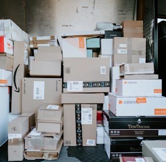 brown cardboard boxes on black plastic crate