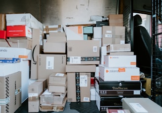 brown cardboard boxes on black plastic crate