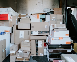 brown cardboard boxes on black plastic crate