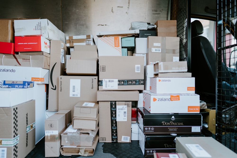 brown cardboard boxes on black plastic crate