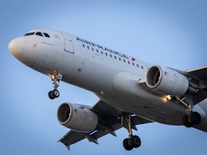 white passenger plane in the sky during daytime