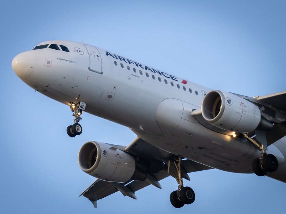 white passenger plane in the sky during daytime