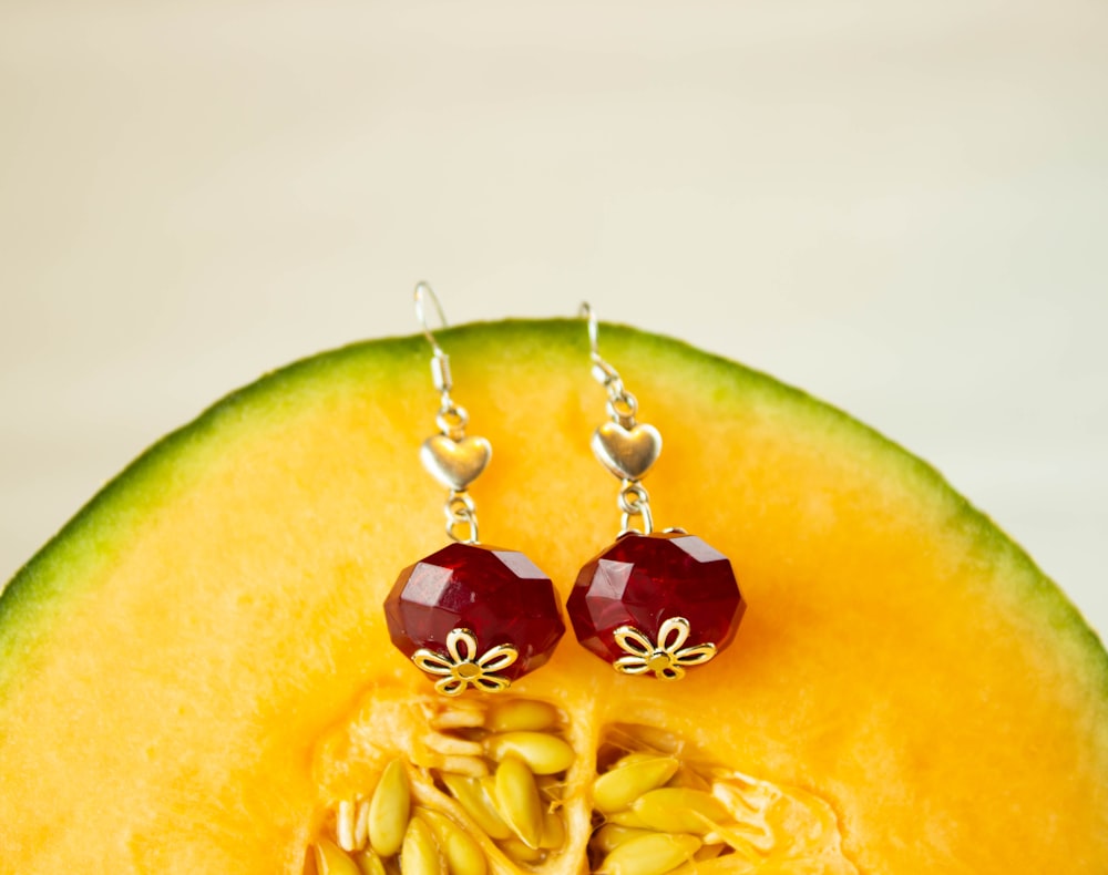 sliced watermelon with red and gold baubles