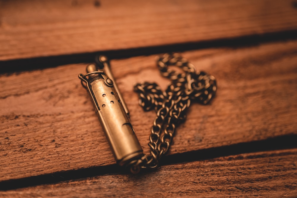 silver tube on brown wooden table