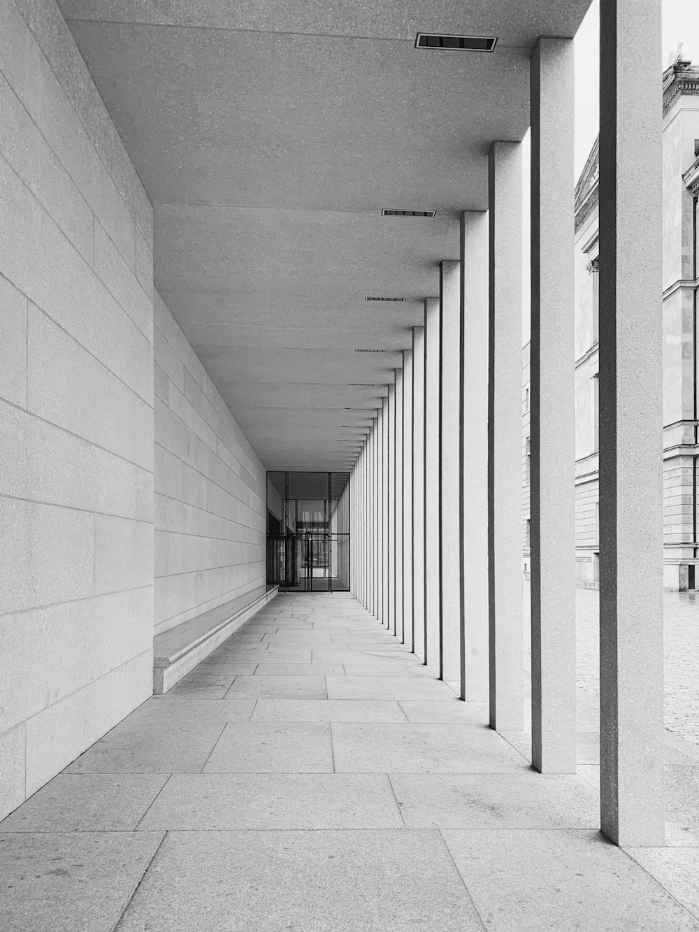 grayscale photo of empty hallway