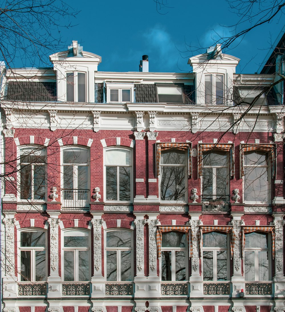 red and white concrete building under blue sky during daytime