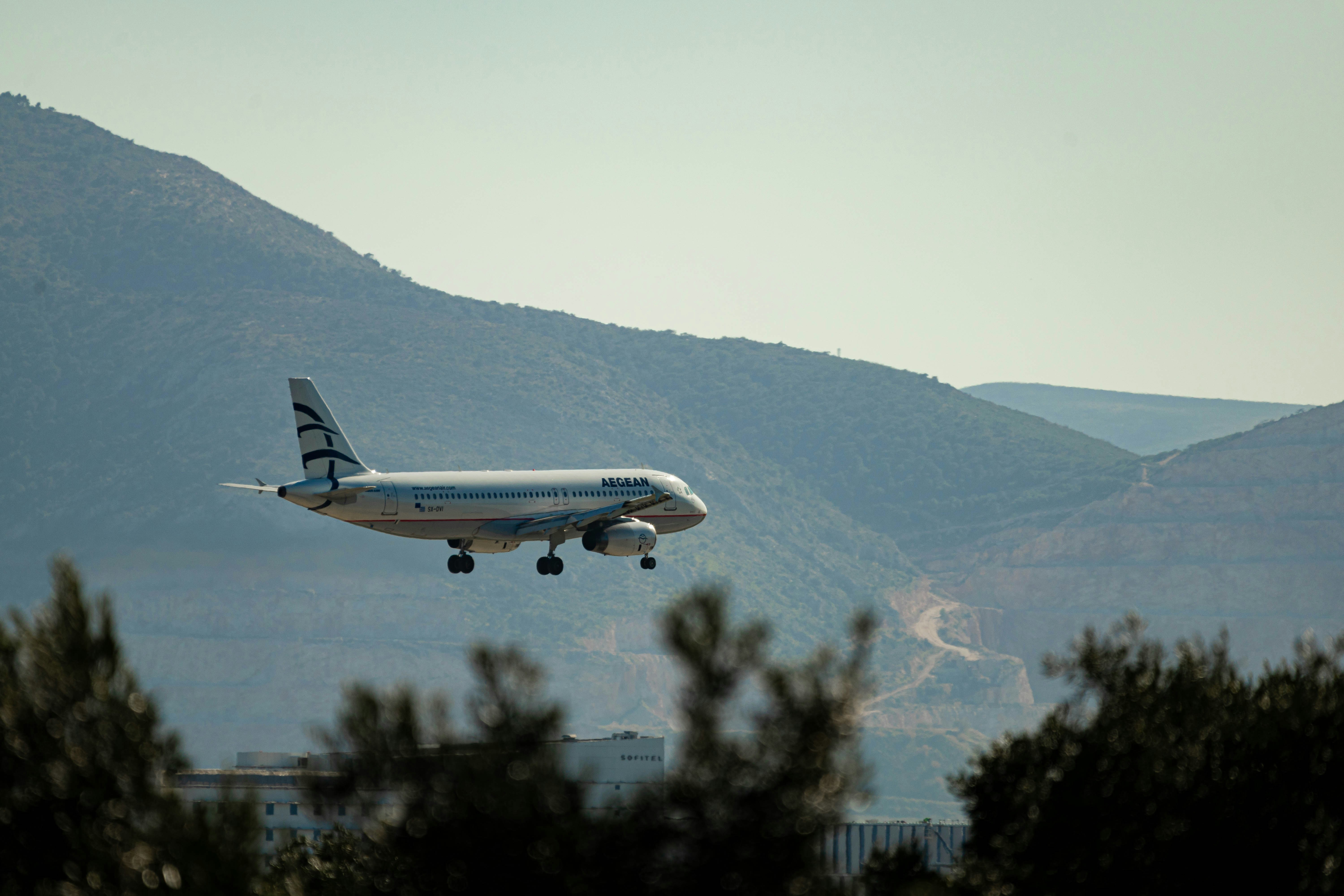 white airplane flying over green trees during daytime, EL. VENIZELOS [ATH] Airport aviation photography.</p>

<p style="margin-bottom: 24px; font-size: 18px; line-height: 1.8; text-align: left; color: #2d3748;">Aegean Airbus A320